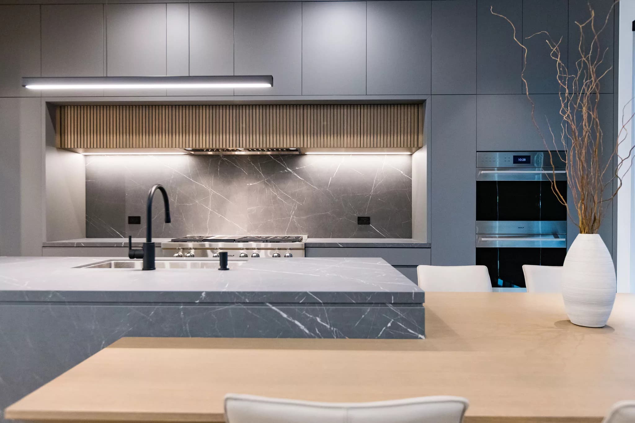 Gray sofa against concrete wall